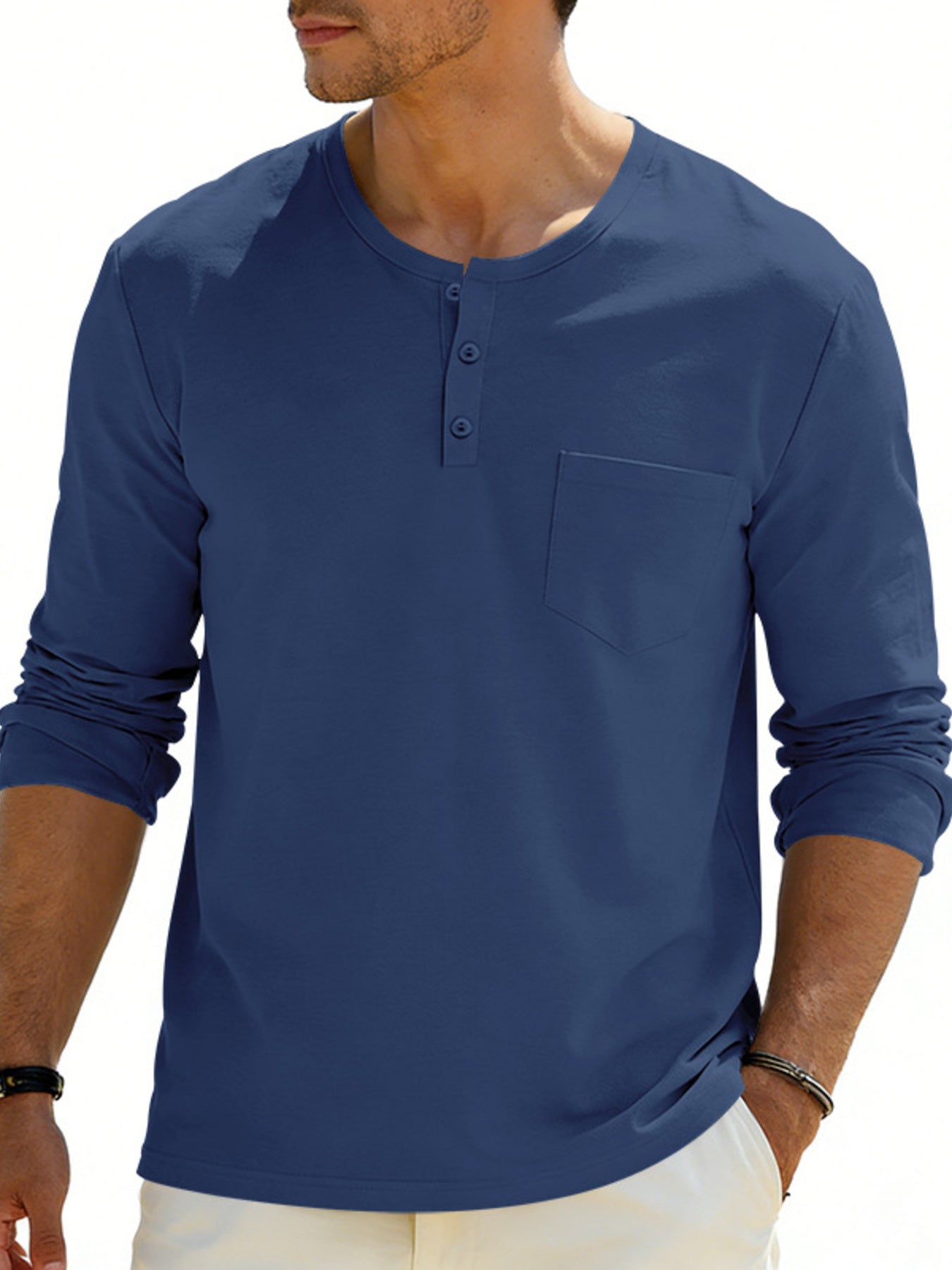 Blue long sleeve pocketed henley t-shirt with button placket.