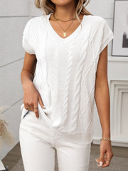 White cable knit V-neck vest with short sleeves and textured stitching.