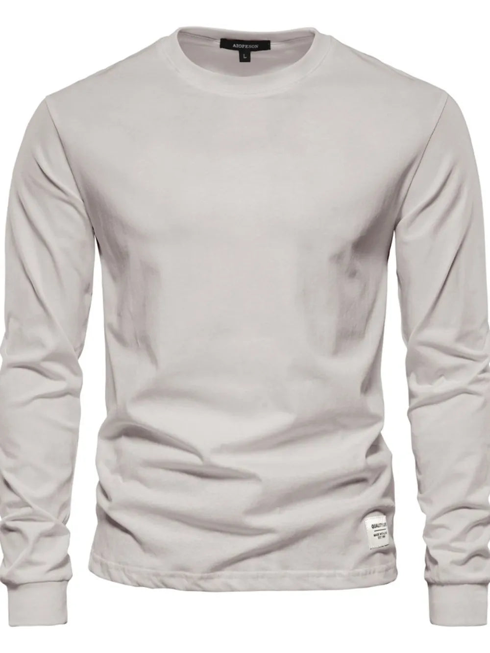 Light Gray crewneck long sleeve t-shirt with a small tag detail on the hem.