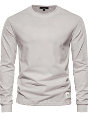 Light Gray crewneck long sleeve t-shirt with a small tag detail on the hem.