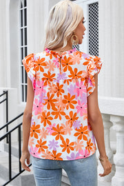 Multicolor floral print blouse with flutter sleeves and ruffled neckline.