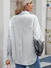 Relaxed fit pinstripe button-down shirt with back button detail.