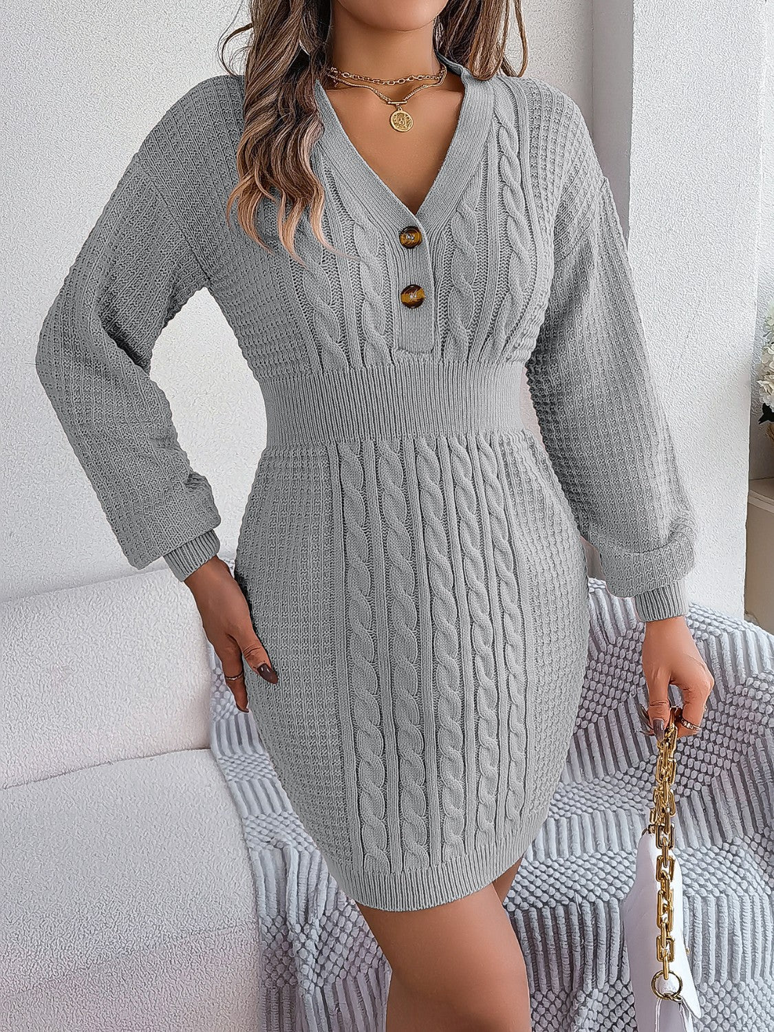 Charcoal cable knit button-front hourglass dress with V-neck and long sleeves.