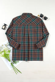Plaid snap jacket in brown, green, and tan plaid with a collared neckline and long sleeves.