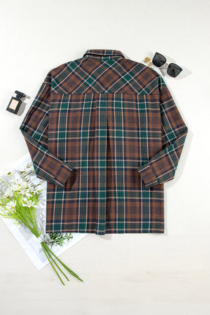 Plaid snap jacket in brown, green, and tan plaid with a collared neckline and long sleeves.