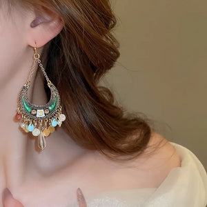 Bohemian crescent drop earrings in dark green alloy with colorful beads and a dangle charm.