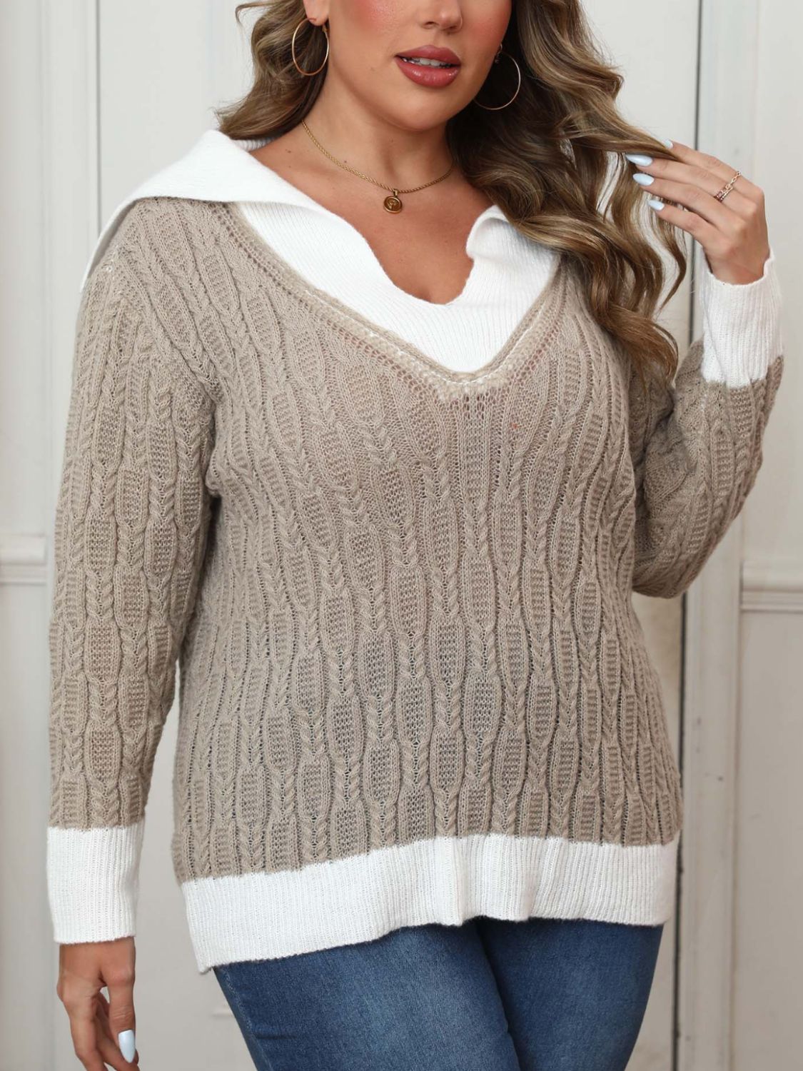 Khaki cable knit sweater with white contrast collar and cuffs.