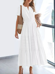 White ruched V-neck tiered midi dress with short sleeves and pockets.