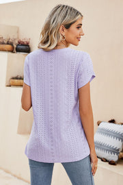Perforated sleeve detail knit top in lavender with allover eyelet pattern.