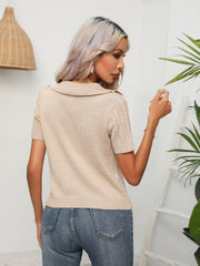 Tan cable knit polo top with short sleeves and a spread collar.