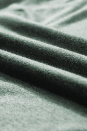Textured sage green V-neck sleeveless tank top fabric detail