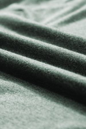 Textured sage green V-neck sleeveless tank top fabric detail