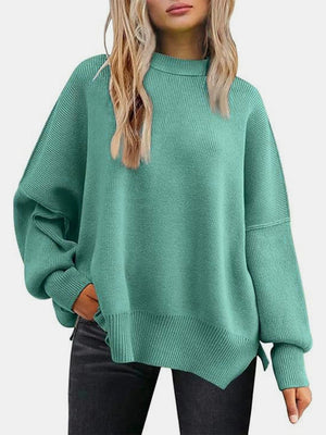 Mint green ribbed knit sweater with slouchy sleeves and mock neck.