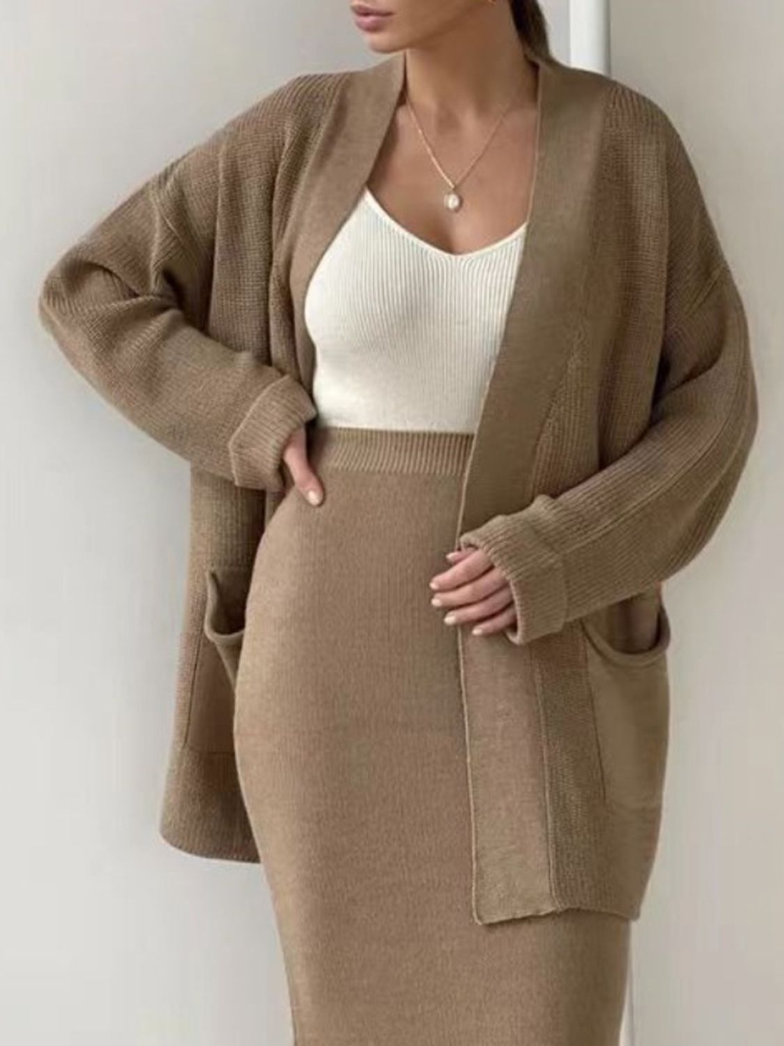 Camel ribbed knit co-ord set with open cardigan and pencil skirt.