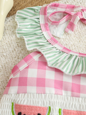 Baby one-piece swimsuit with pink gingham, green stripe ruffles, and watermelon embroidery.