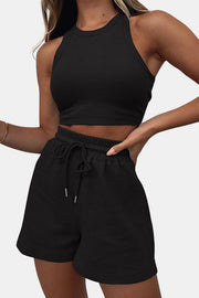 Black ribbed knit crop top and drawstring shorts set with a racerback neckline.