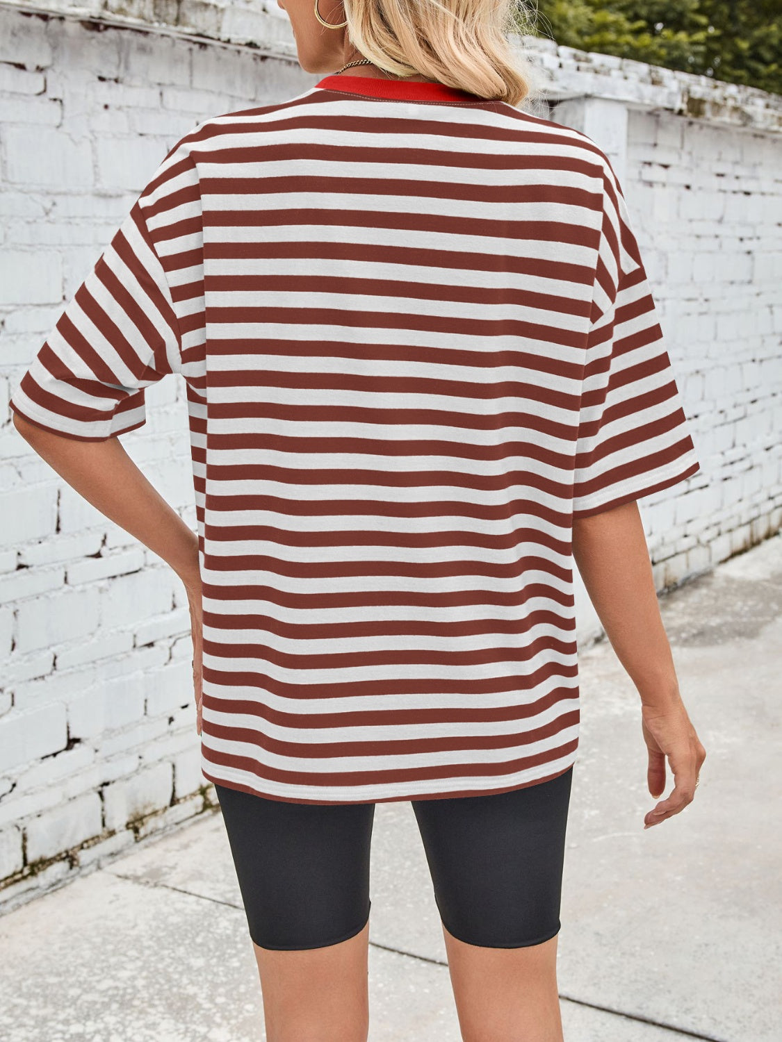 Brown and white striped relaxed tee with contrast red neckline.