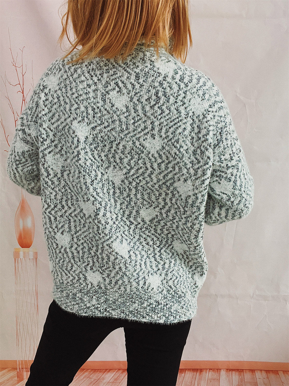 Mint blue acrylic turtleneck sweater with textured heart pattern and relaxed fit.