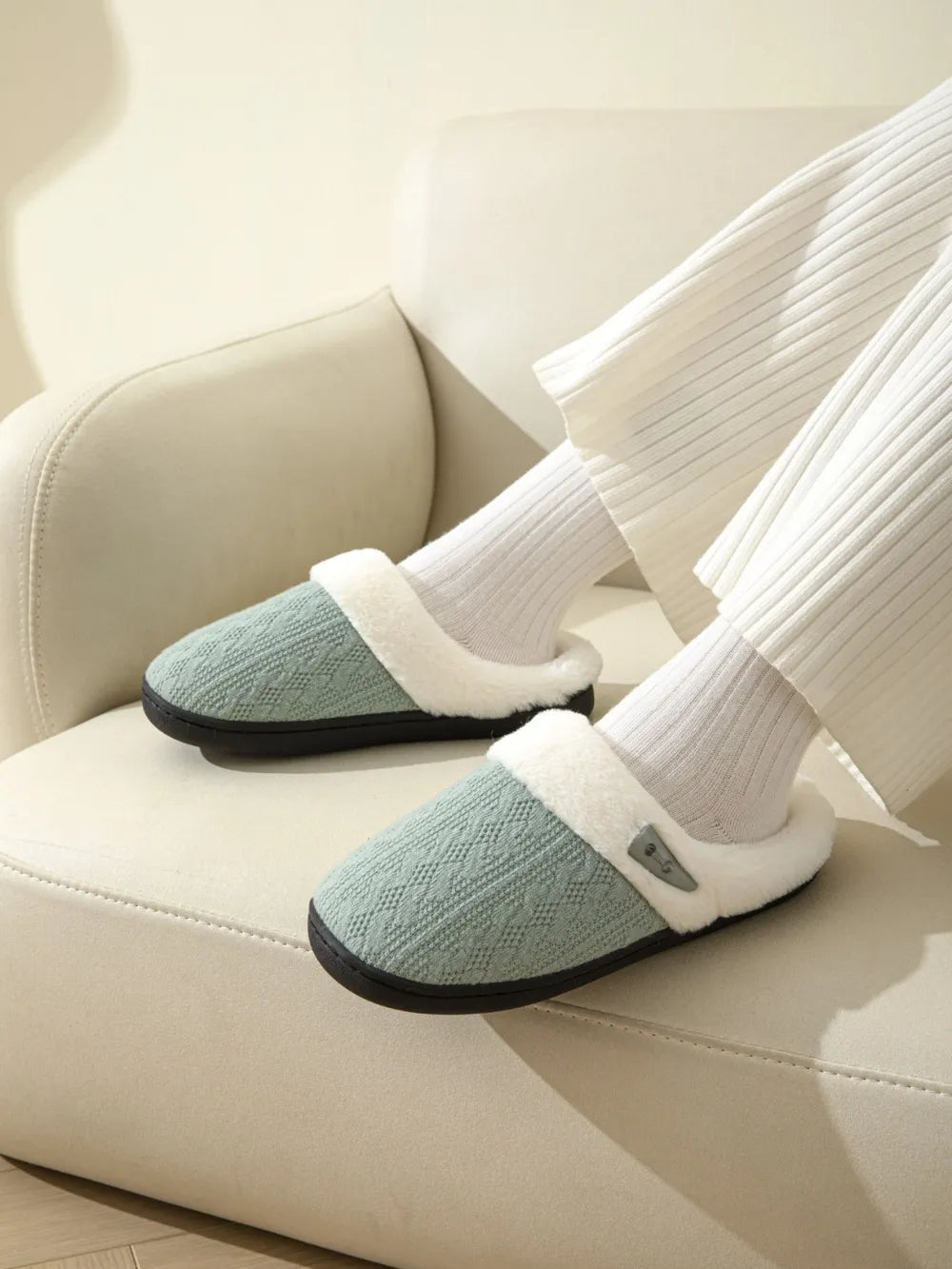 Dusty Blue cable knit shearling house slippers with plush lining.