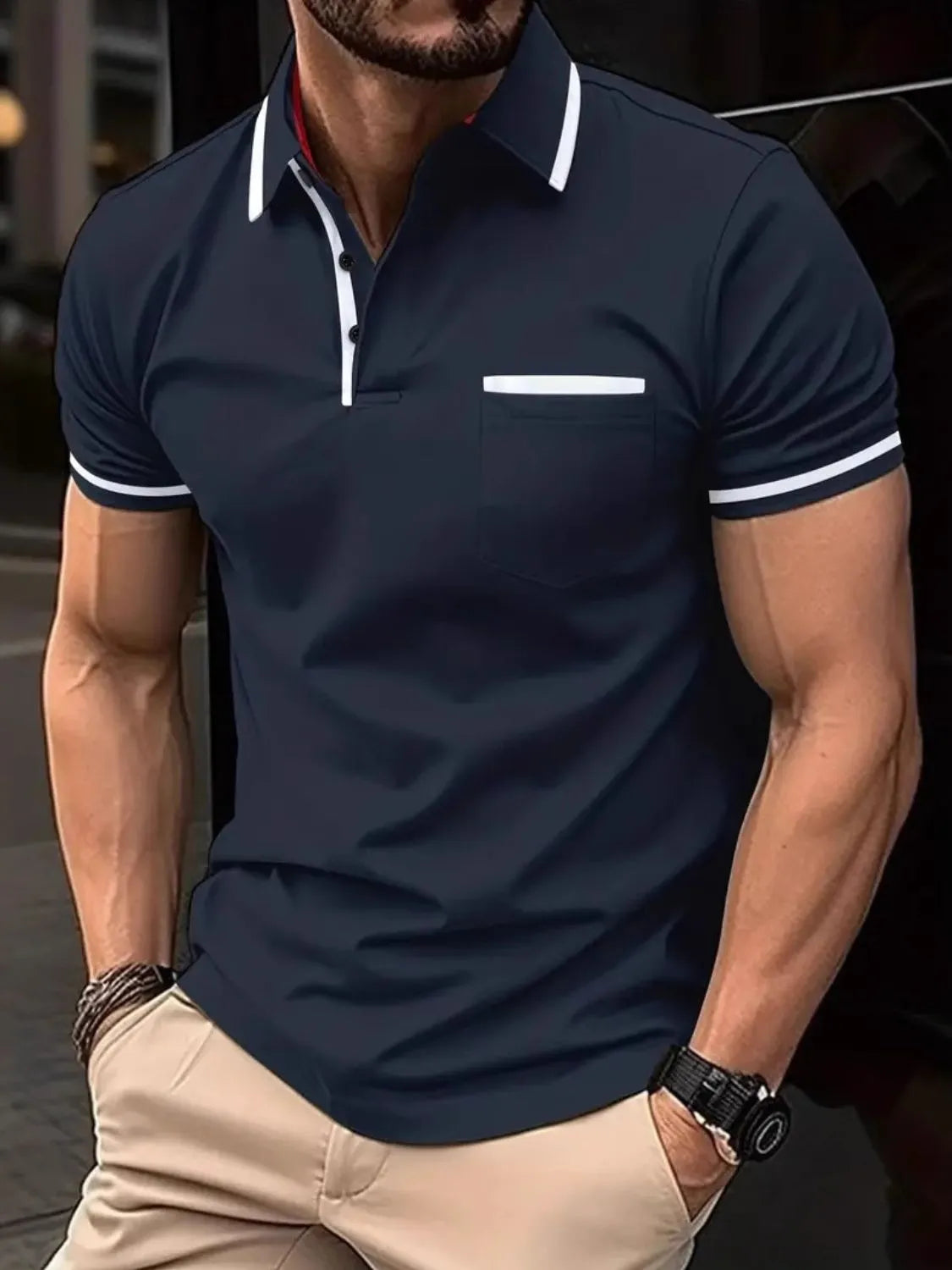 Navy short sleeve polo with white contrast trim on collar, pocket, and sleeves.