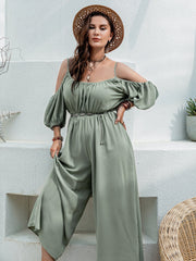 Sage off-shoulder jumpsuit with gathered waist and balloon sleeves.