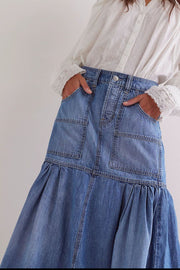 Denim midi skirt in medium wash with flounce hem and patch pockets.