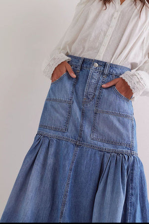 Denim midi skirt in medium wash with flounce hem and patch pockets.