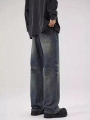 Men's relaxed fit jeans in washed blue denim with a vintage look.