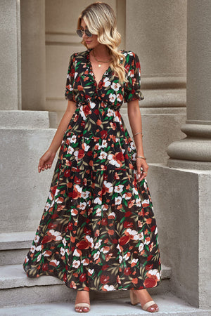 Black floral maxi dress with puff sleeves and tiered skirt
