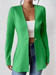 Green single-button blazer with tailored fit and textured fabric.