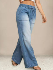 Light blue denim maternity jeans with drawstring waist and wide legs.