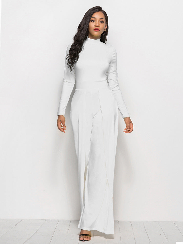 White high-waisted palazzo jumpsuit with slit front and long sleeves.