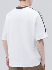White oversized t-shirt with contrast stitching on sleeves and neckline