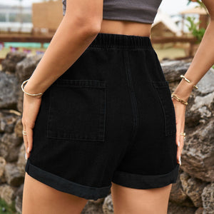 Black denim bermuda shorts with drawstring waist and cuffed hem.