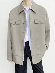 Oversized Khaki button-down jacket with chest pockets and button closure.