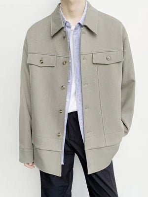 Oversized Khaki button-down jacket with chest pockets and button closure.