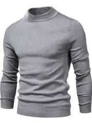 Gray ribbed mock neck sweater with sculpted shoulder detail and long sleeves.