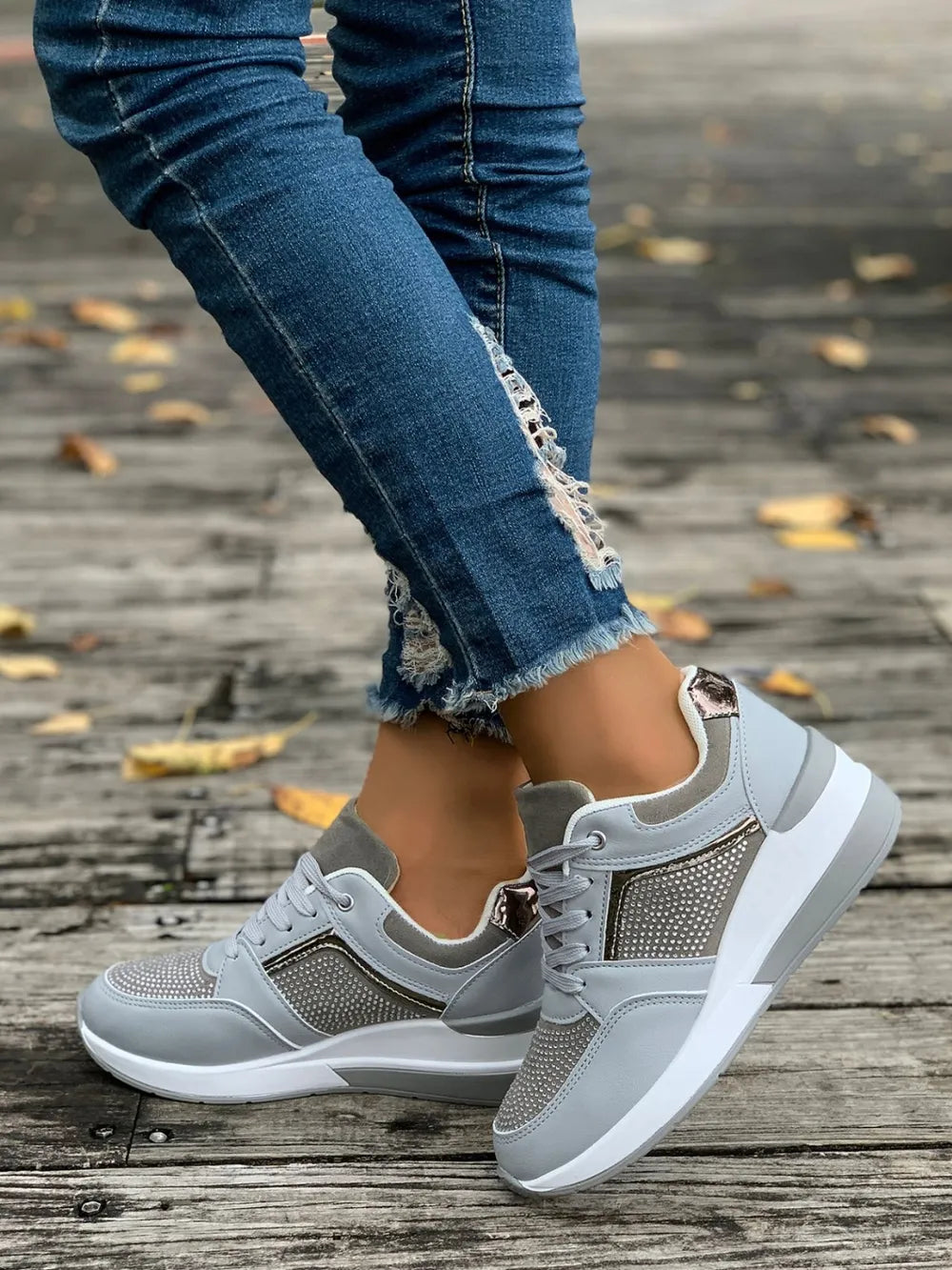 Light gray platform sneakers with gemstone panels and white soles.