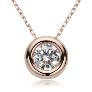 Rose gold solitaire pendant necklace with bezel-set diamond on a delicate chain.
