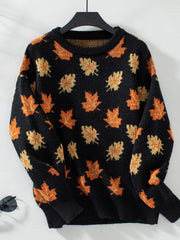 Black knit jumper with autumnal leaf motif, crew neck, long sleeves.