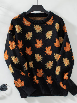 Black knit jumper with autumnal leaf motif, crew neck, long sleeves.