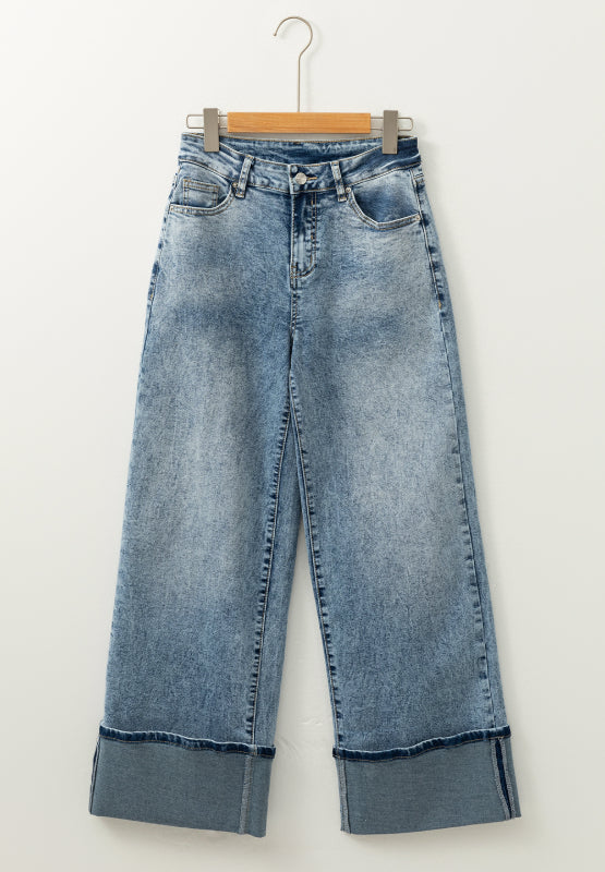 Cuffed hem washed denim trousers in medium acid wash with a wide leg.
