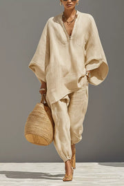 Chic relaxed beige linen two-piece set with V-neck tunic and drawstring pants.