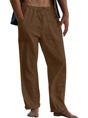 Brown linen drawstring trousers with relaxed fit and cuffed hems.