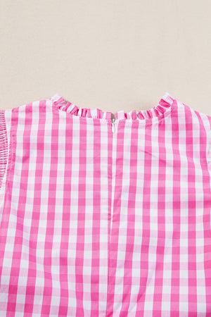 Fuchsia pink gingham blouse with mock neck and ruffle sleeves, back zipper detail.