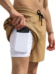 Men's khaki chino shorts with built-in white compression shorts and phone pocket.