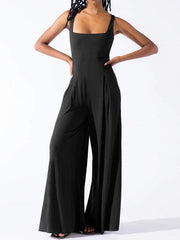Black square neck palazzo jumpsuit with wide legs and pleats.