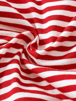 Red and white striped baby pajamas, soft cotton knit fabric.