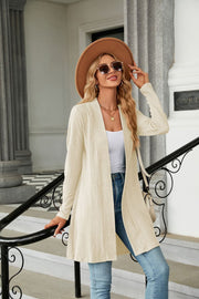 Ivory textured knit open-front duster cardigan with a relaxed fit and long sleeves.