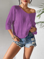 Vivid Violet textured knit dolman sleeve sweater with a V-neck, styled with denim shorts.